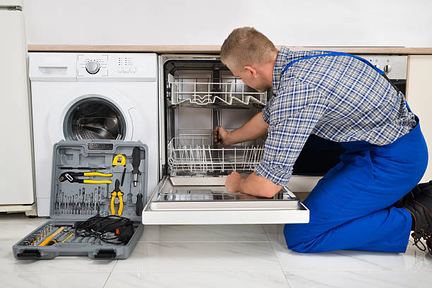 Appliance repair technician working