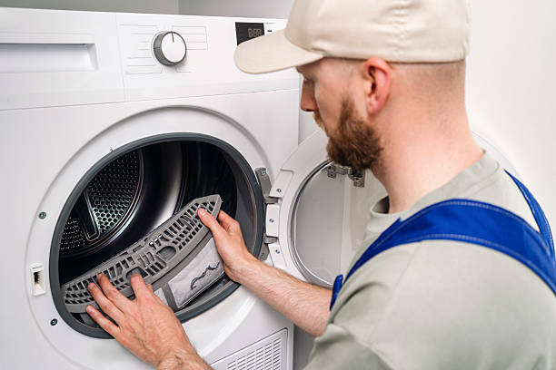 Dryer repair technician working