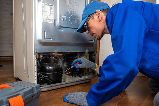 Technician performing a fridge diagnostic