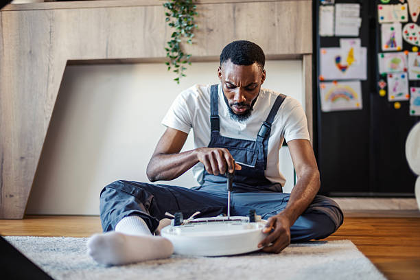 Technician reviewing fridge repair diagnostics