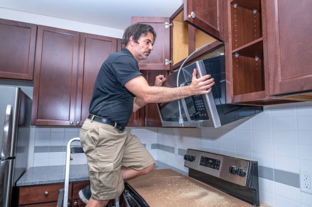 Microwave repair technician working