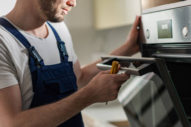 Technician performing an oven diagnostic