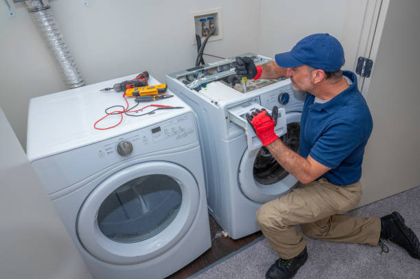 Washer repair technician working