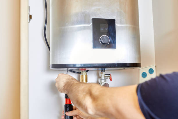 Technician performing a water heater diagnostic
