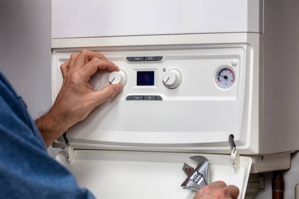 Technician reviewing water heater repair diagnostics